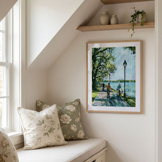 Framed Minneapolis lake bike path art print displayed in a styled interior.