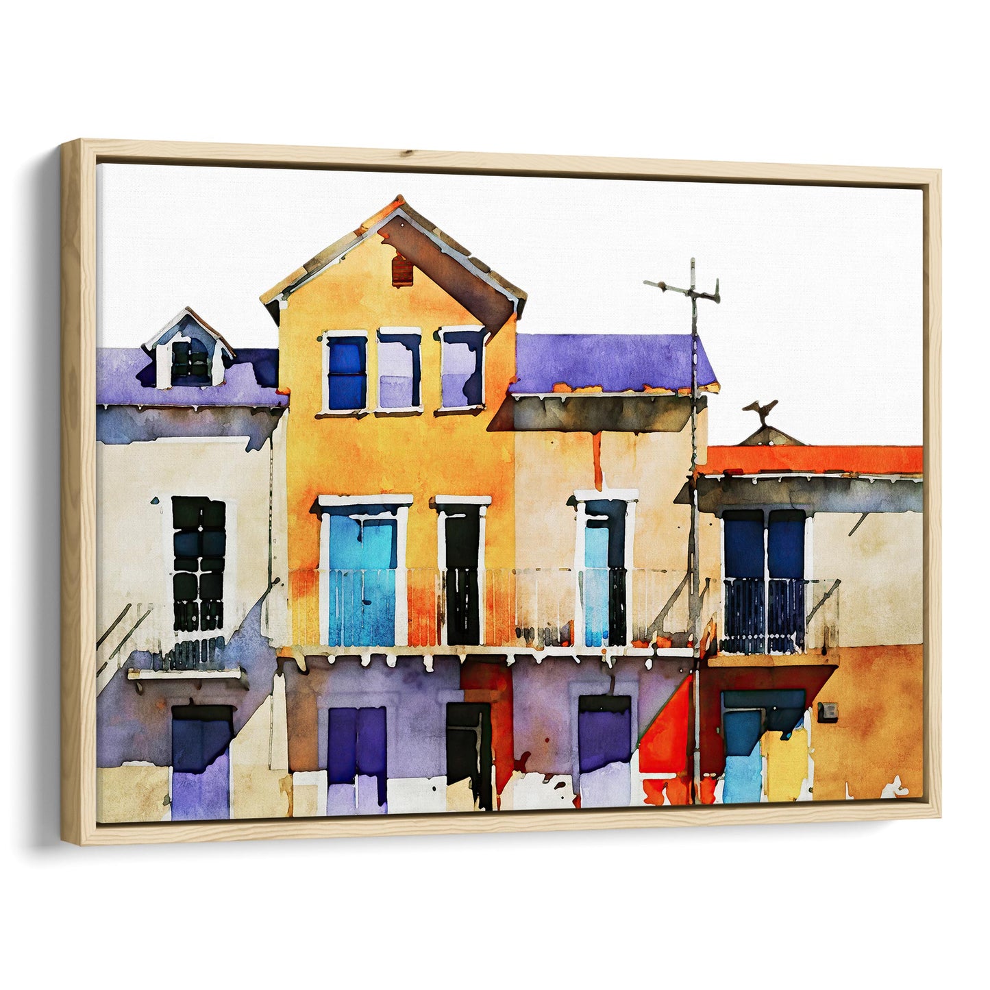 Framed canvas print of a watercolor painting featuring colorful buildings with blue, yellow, and purple facades, set in a natural wood frame.