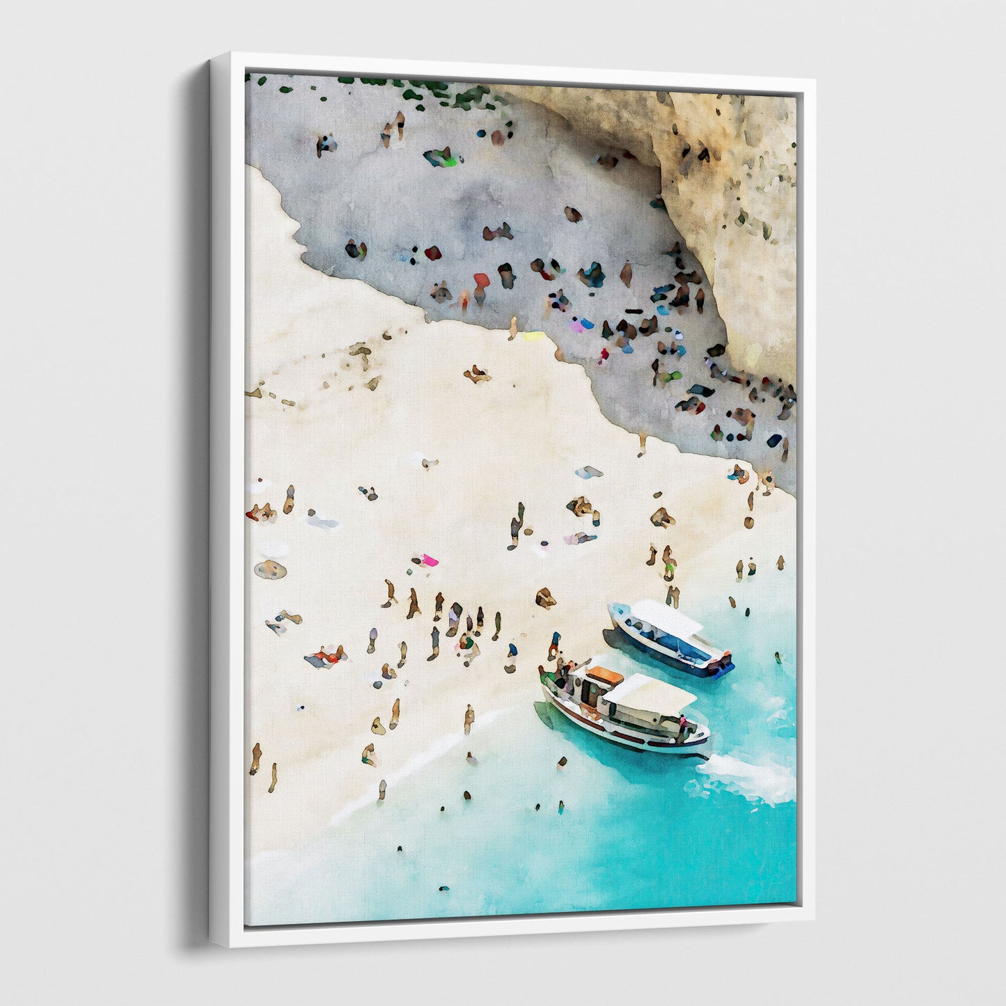 A framed canvas print featuring a watercolor-style artwork of a busy beach with two boats on clear turquoise water and sunbathers on sandy terrain, framed in white.