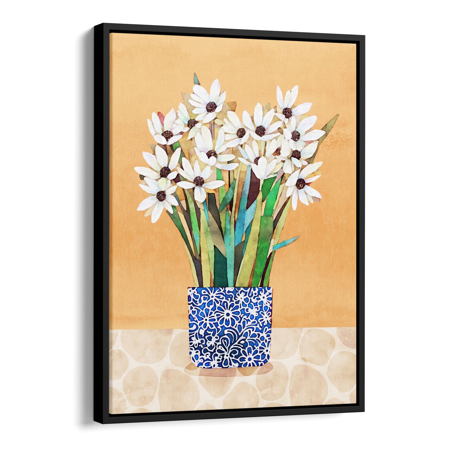 Black framed canvas artwork featuring white flowers with dark centers in a blue patterned vase on a beige patterned surface with an orange background.
