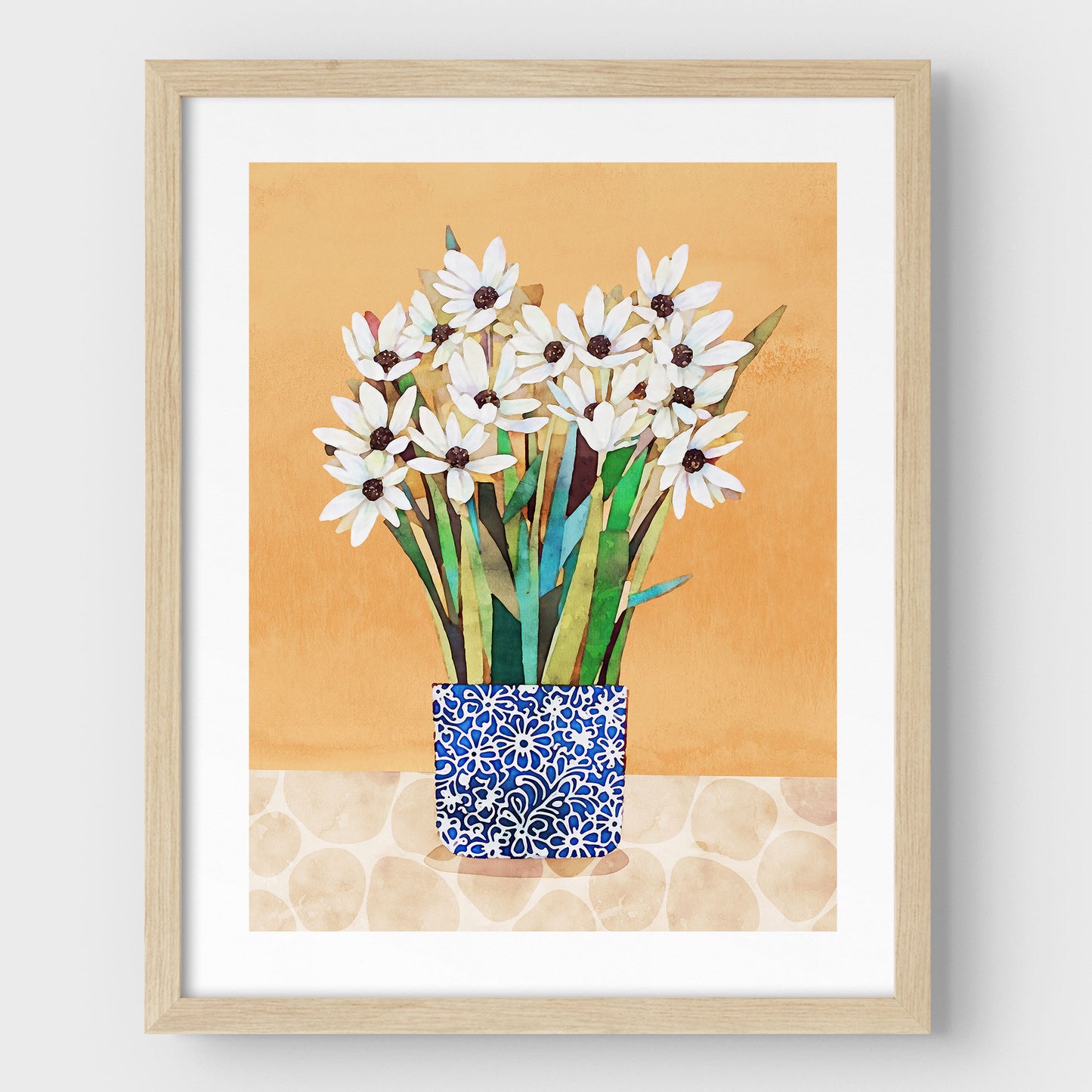 Print of white flowers with dark centers in a blue patterned vase on a beige patterned surface with an orange background, set in a natural frame.