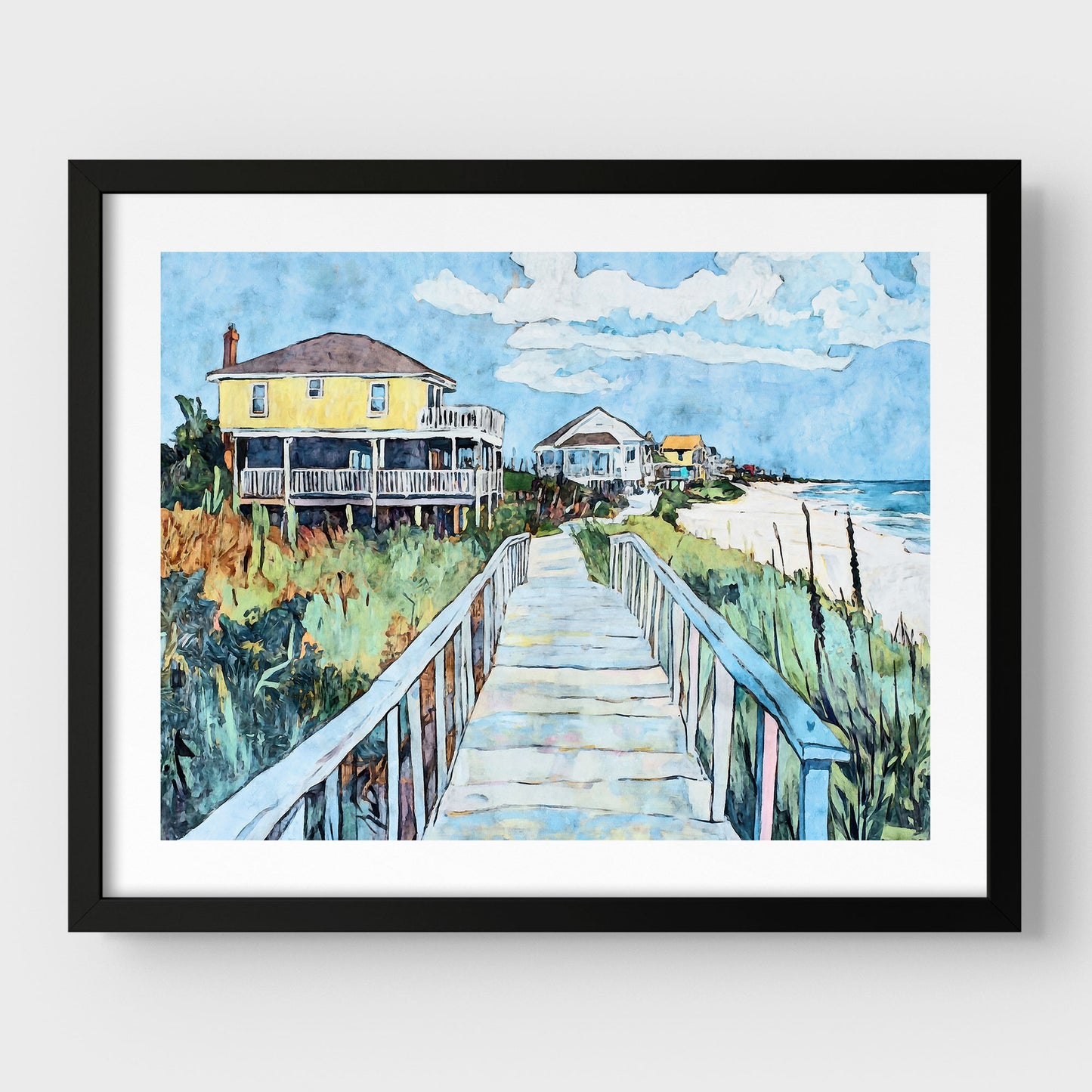 Black framed watercolor-style artwork depicting a sunny coastal boardwalk leading to a row of colorful beach houses, with a bright yellow home in the foreground, lush dune grasses on either side, and the ocean visible on the right.