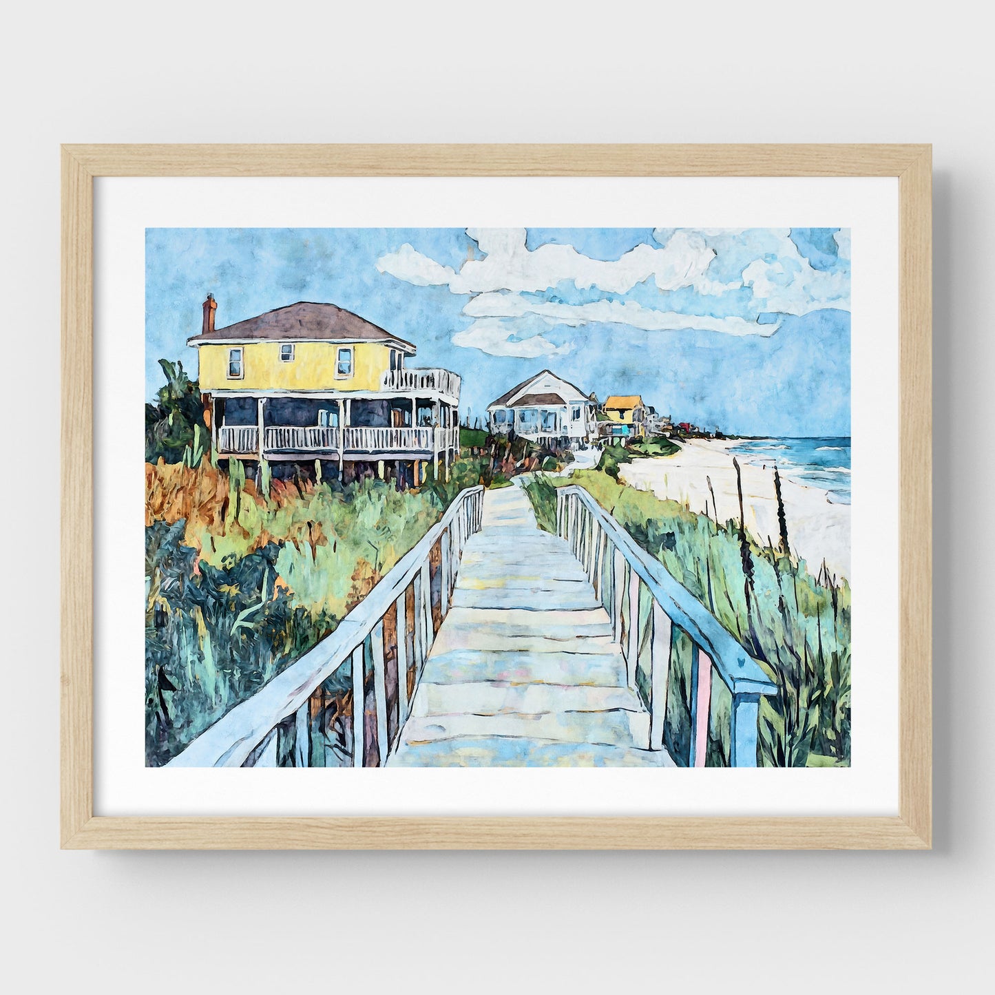 Natural wood framed watercolor-style artwork depicting a sunny coastal boardwalk leading to a row of colorful beach houses, with a bright yellow home in the foreground, lush dune grasses on either side, and the ocean visible on the right.