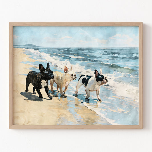 Digital watercolor print of three French Bulldogs on a beach with blue ocean waves and tan sand in a natural wood frame.