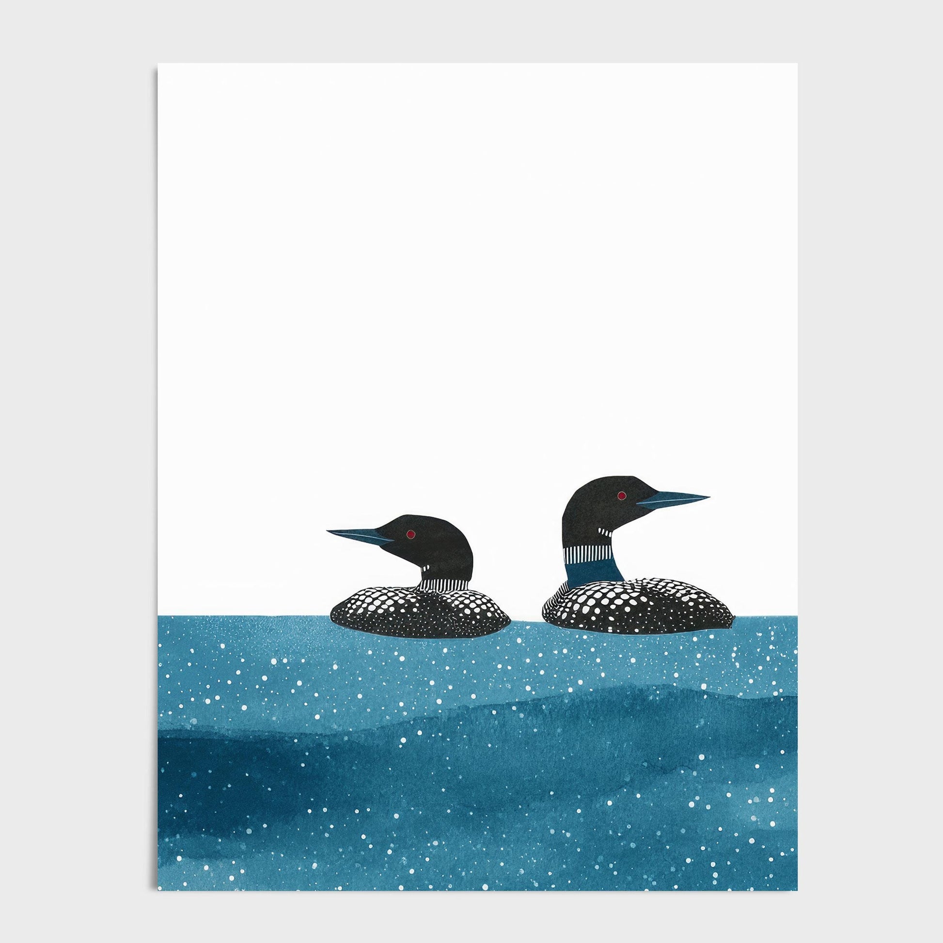 Minimalist illustration of two loons with black-and-white patterned feathers and red eyes floating in deep blue water speckled with white dots, set against a crisp white background. The simple composition emphasizes the birds’ graceful forms and tranquil movement.
