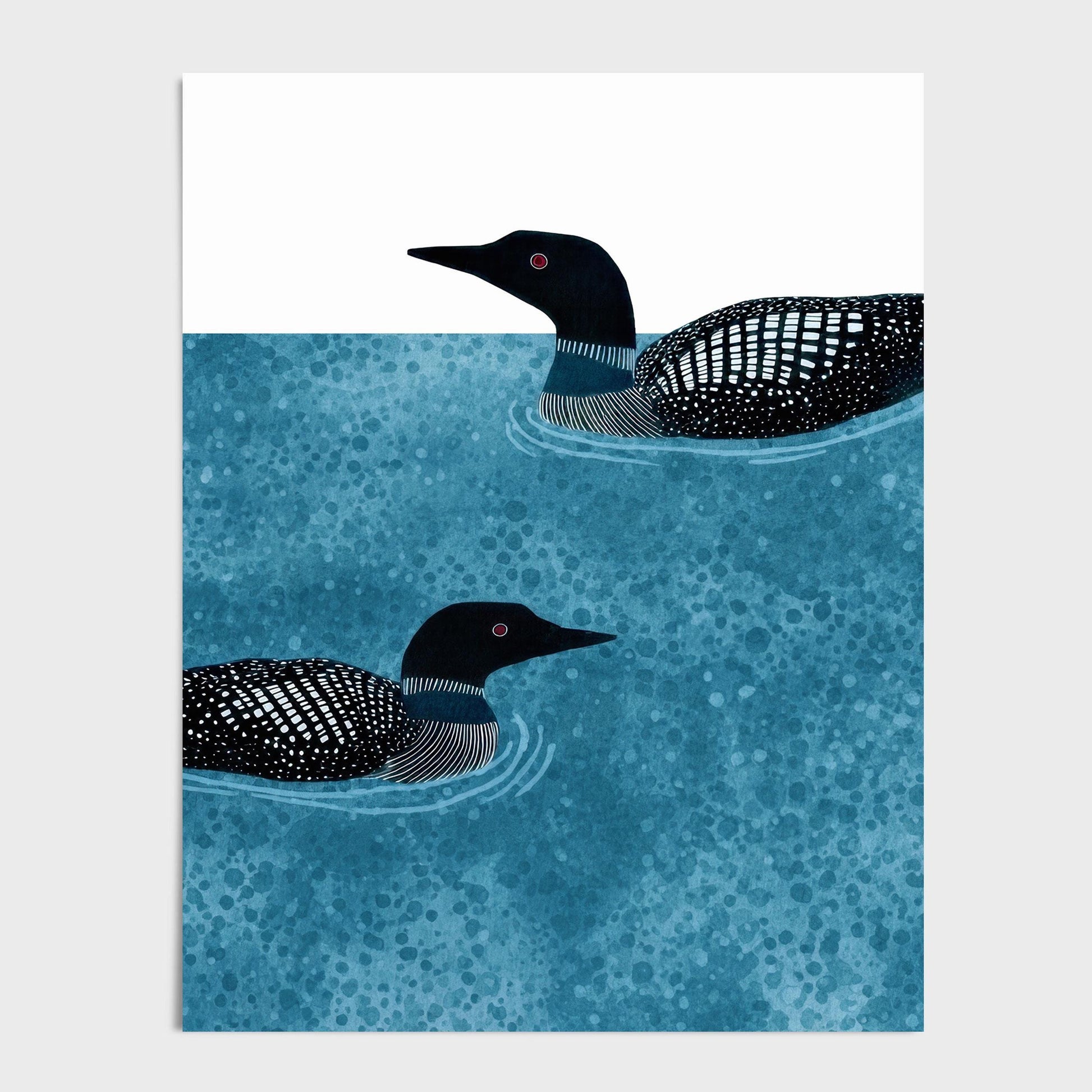 Vertical illustration of two loons swimming in textured blue water, their black-and-white patterned feathers and red eyes contrasting against a simple white background. The composition emphasizes calm movement and balance within a clean, modern design.