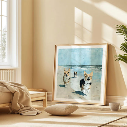 Framed square painting of three corgis joyfully running on a sandy beach toward the viewer, with waves and a blue sky in the background, displayed leaning against a wall in a sunlit, minimal bedroom with warm neutral tones.