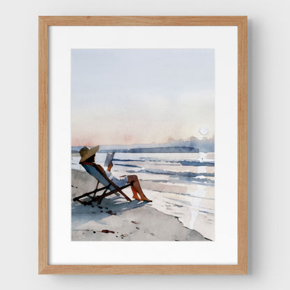 Woman Reading at Sunset Beach Art Print