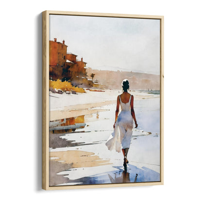 A natural wood framed canvas print of a watercolor painting showing a woman in a flowing white dress walking barefoot along the beach.