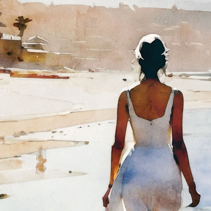 A close-up of a watercolor painting depicts a woman walking along the beach. She is shown from behind, wearing a flowing white dress. The soft, muted colors highlight the serene atmosphere of the shoreline and the warm tones of the distant buildings and landscape.
