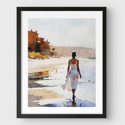 A black framed watercolor painting of a woman in a flowing white dress walking along the shoreline at sunset. 