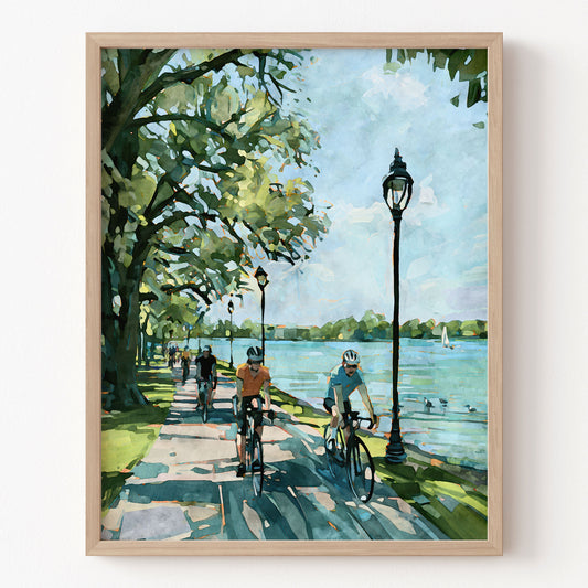 Watercolor-style Minneapolis Chain of Lakes bike path art print in a natural wood frame.