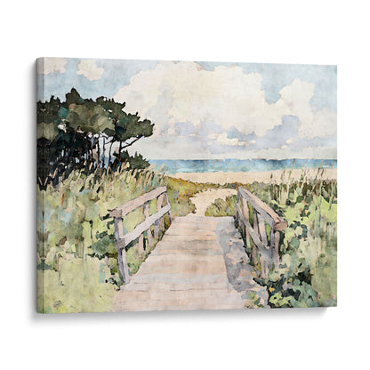 Gallery-wrapped canvas print of a peaceful beach boardwalk scene, illustrated in watercolor style. A soft wooden path flanked by railings leads through windswept grasses and coastal trees toward the sea. Gentle blue waves and fluffy white clouds complete the serene horizon, creating a soothing coastal vibe.
