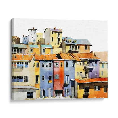 Canvas print of a watercolor painting depicting a colorful hillside village with vibrant buildings, mounted on a white background.