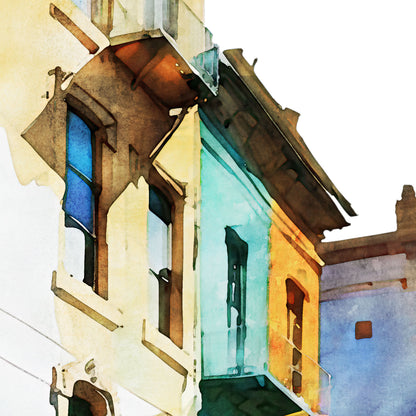 Close-up of a watercolor painting showing colorful building facades with intricate balconies and blue, green, and orange tones.