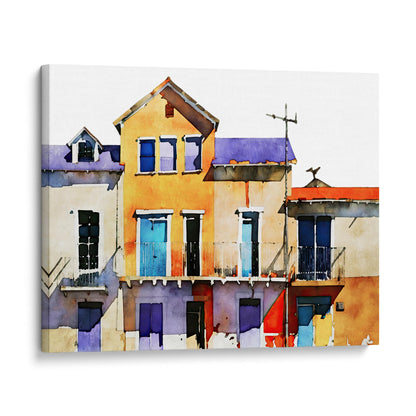 Canvas print of a watercolor painting depicting colorful buildings with blue, yellow, and purple facades, mounted on a white background.
