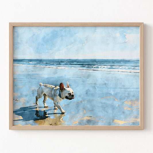 Digital watercolor print of a cream French Bulldog walking on a beach with blue ocean waves in a natural wood frame.