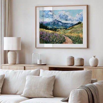 Framed landscape painting above a sofa in a living room