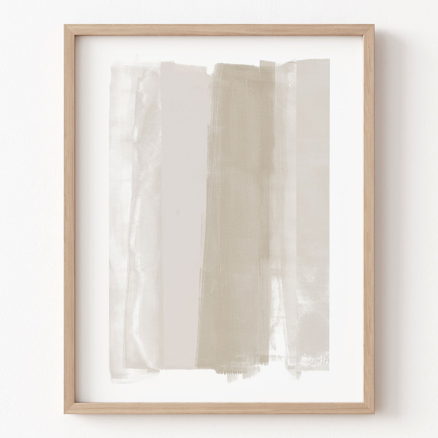 Framed abstract art with horizontal brush strokes in beige and white on a white background