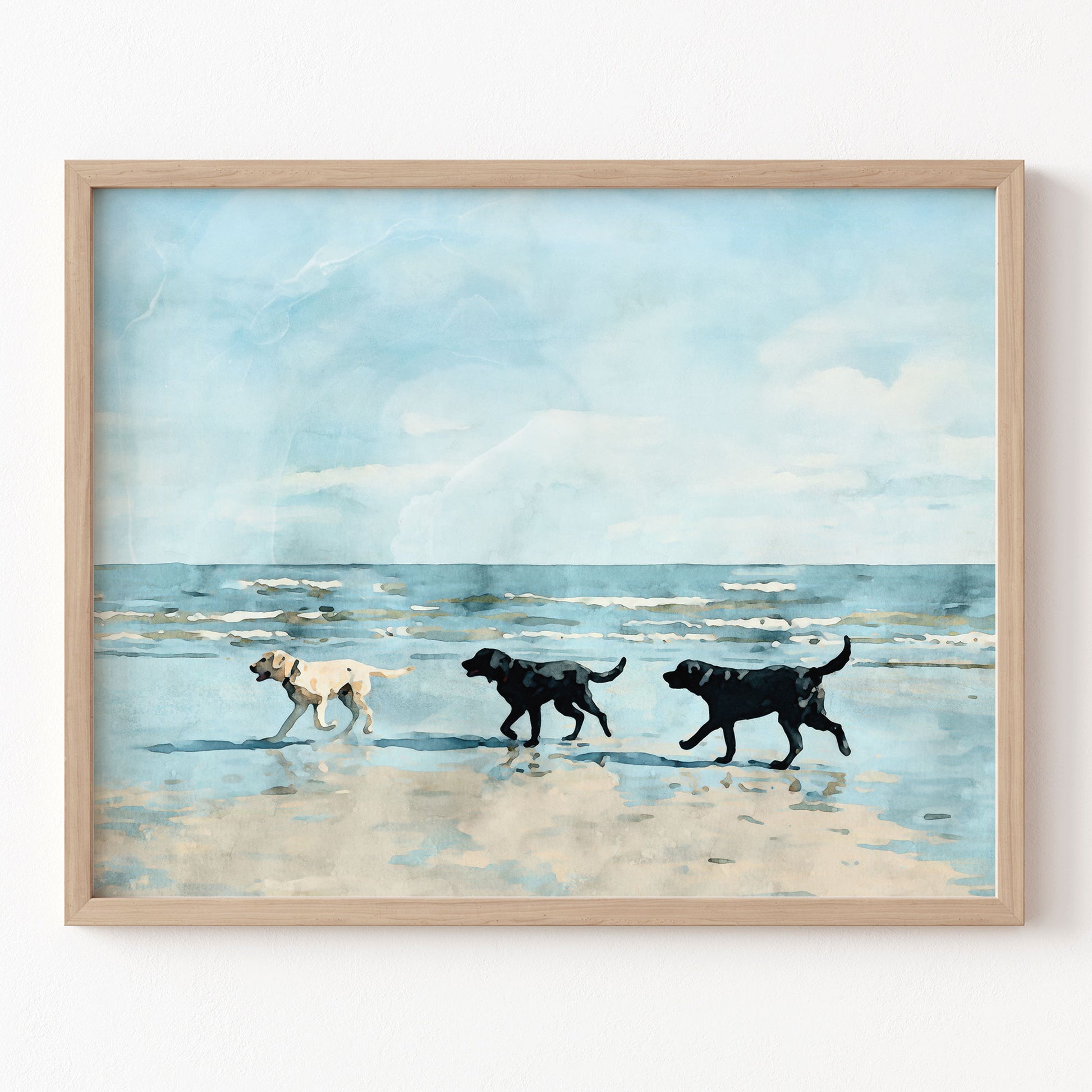 Framed artwork of three dogs walking on a beach with a blue sky.