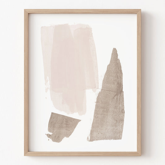 Framed abstract art with beige and brown shapes on a white background