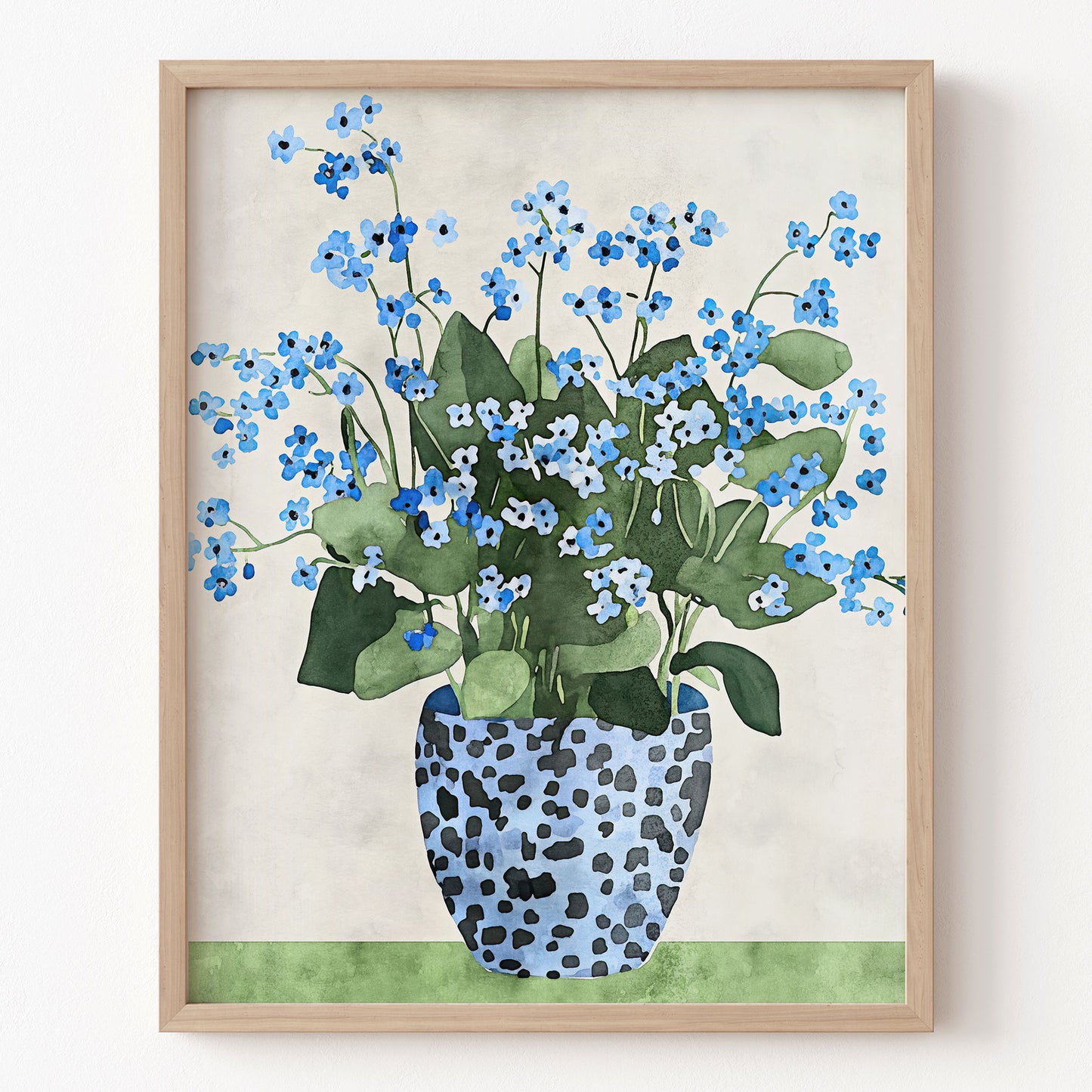 Framed artwork of blue flowers in a spotted vase on a beige background