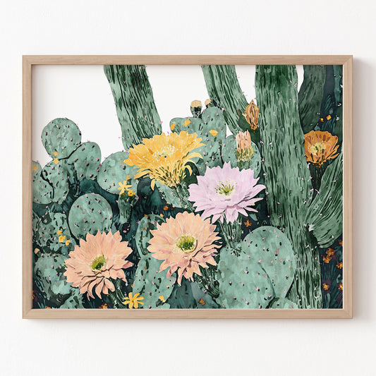 Framed artwork of cacti with colorful flowers on a white wall