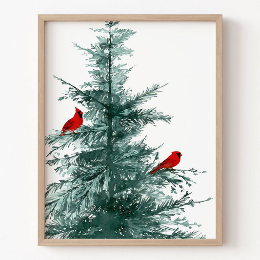 Framed artwork of a Christmas tree with red cardinals on a white background