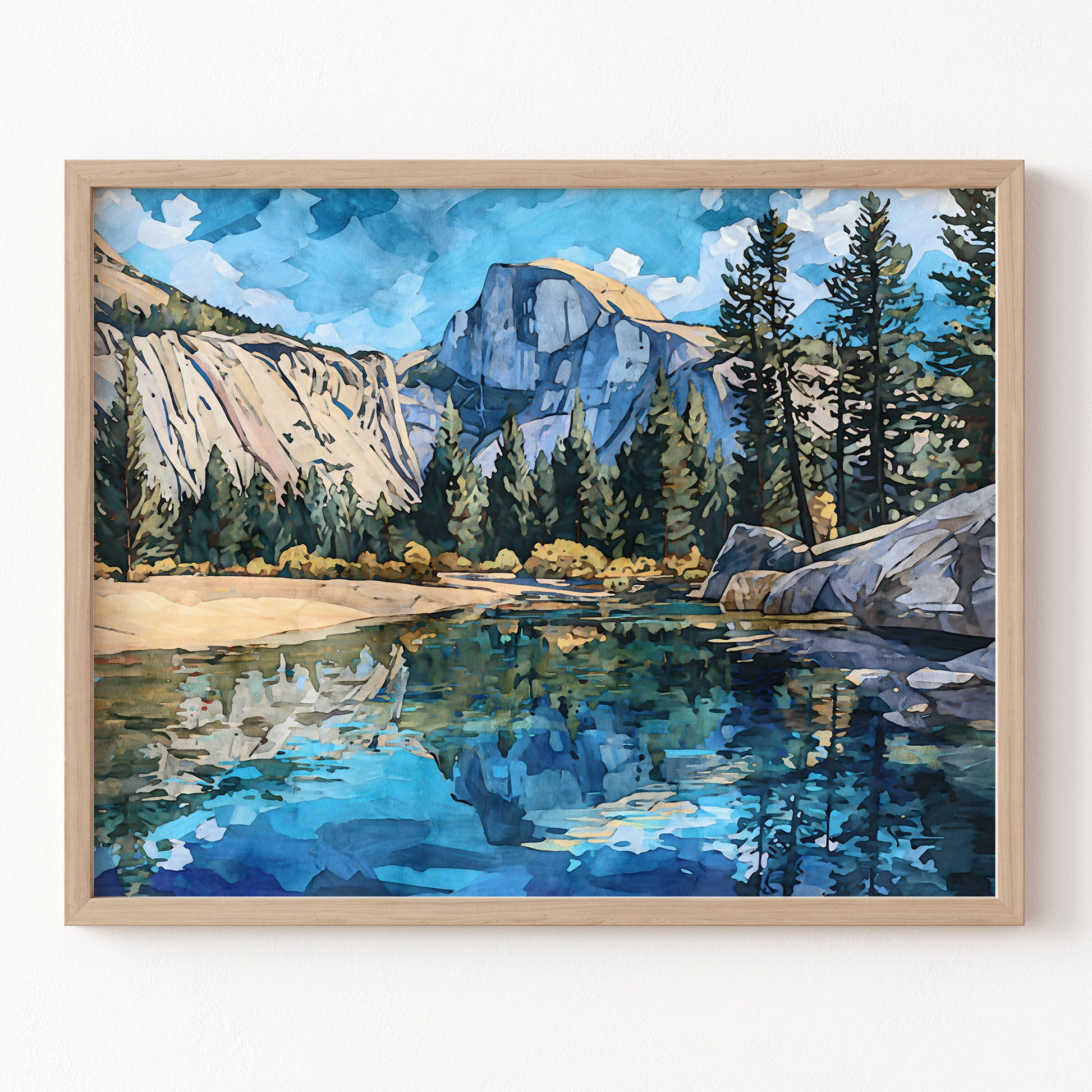 Framed painting of a mountain landscape with a lake and trees.