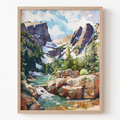 Framed painting of a mountain landscape with a river and trees.