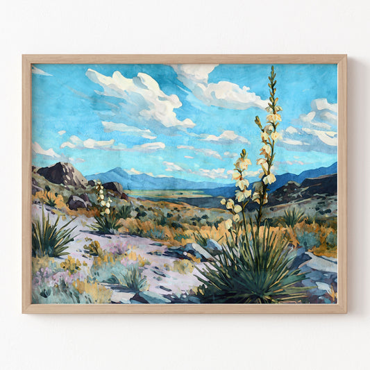 Framed painting of a desert landscape with mountains and white flowers.