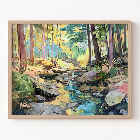 Framed watercolor painting of a forest stream on a white wall
