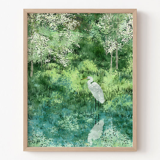 Framed artwork of a white egret in a forest setting