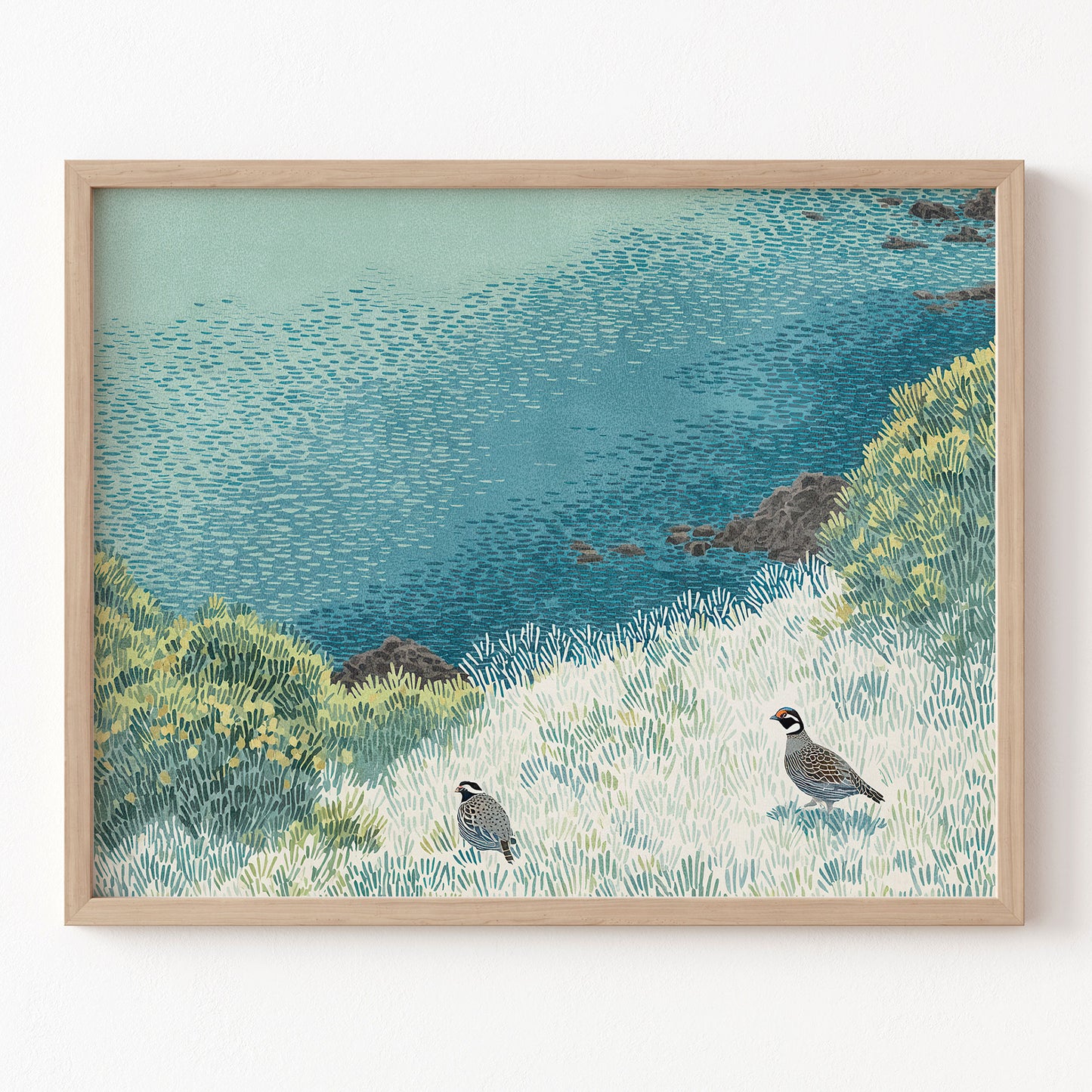 Framed artwork of a coastal scene with birds and water.
