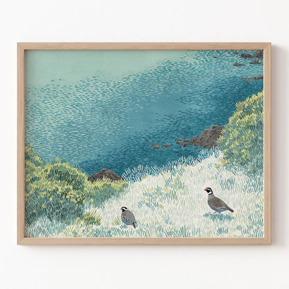 Framed artwork of a coastal scene with birds and water.