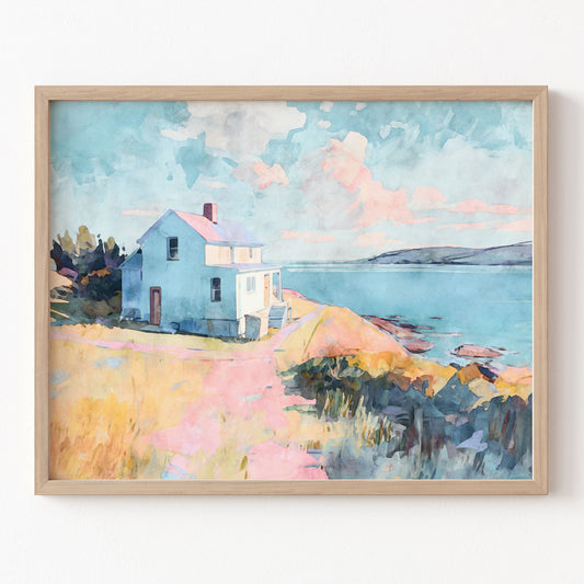 Framed watercolor painting of a house by a lake with a colorful sky.