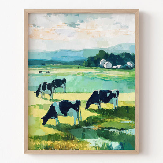 Framed painting of cows grazing in a field with mountains and trees.