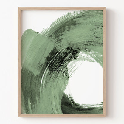 Framed abstract art with green and black brush strokes on a white background