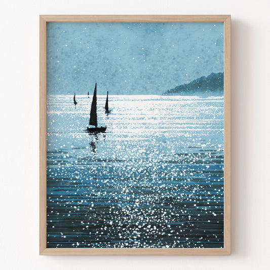 Framed artwork of sailboats on a sparkling water surface with a mountain in the background.