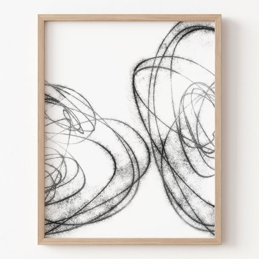 Framed abstract art print with black line drawings on a white background