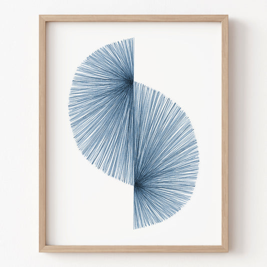 Framed abstract art piece with blue circular design on a white background