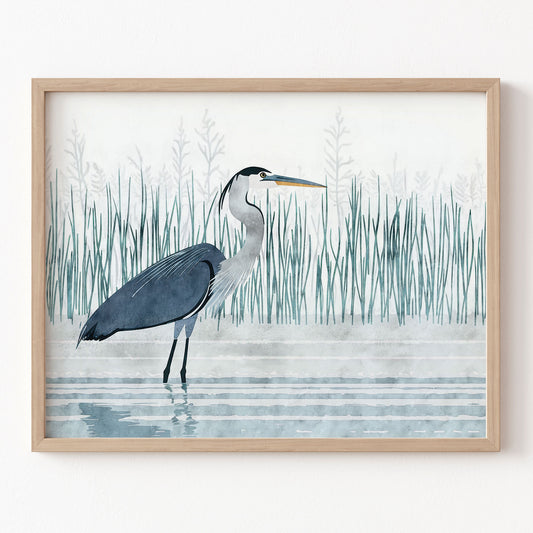 Framed artwork of a heron in a natural setting with reeds and water.