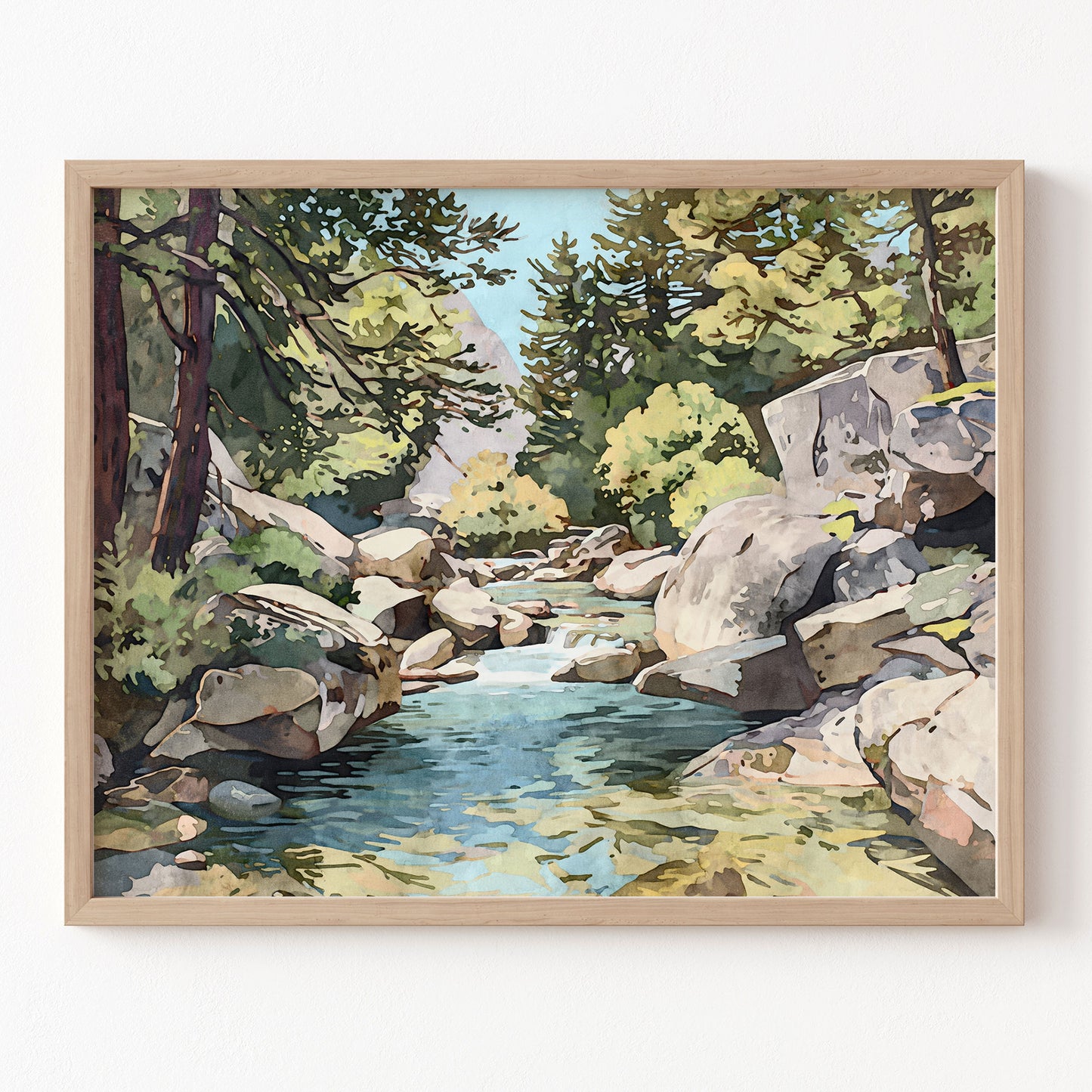 Framed artwork of a landscape with a stream and rocks on a white wall