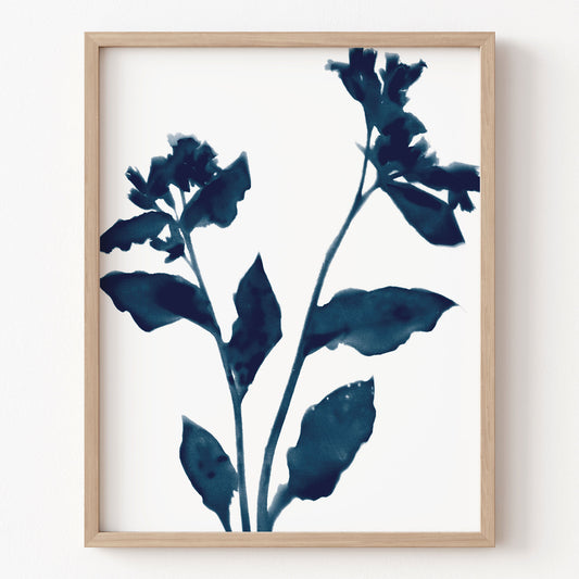 Framed artwork of blue floral design on a white background