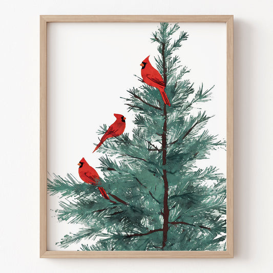 Framed artwork of three red cardinals on a tree with a wooden frame.