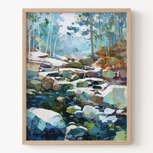 Framed artwork of a snowy forest scene with a stream.
