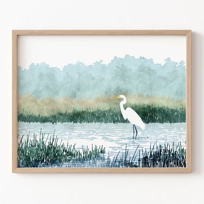 Framed artwork of a white egret in a marsh with a natural landscape.