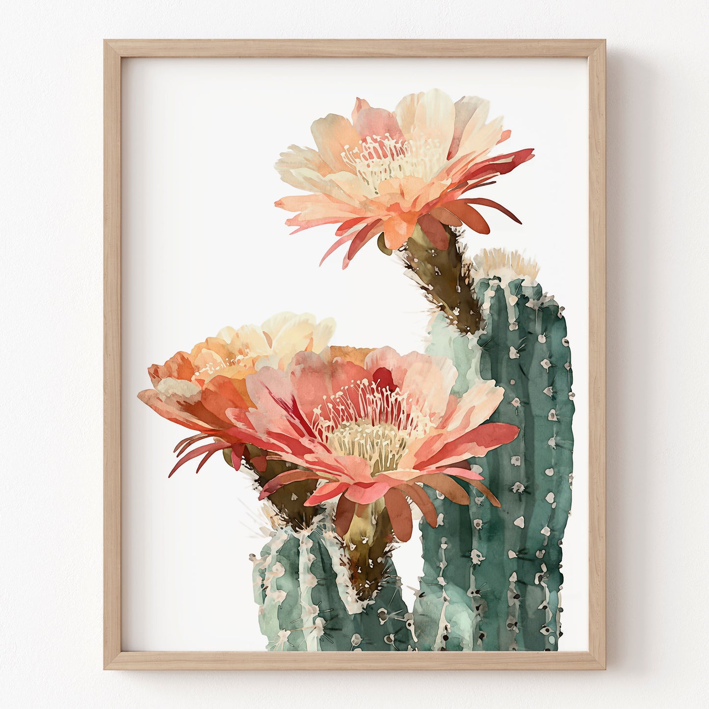 Framed artwork of a cactus with pink flowers on a white background