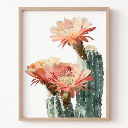 Framed artwork of a cactus with pink flowers on a white background