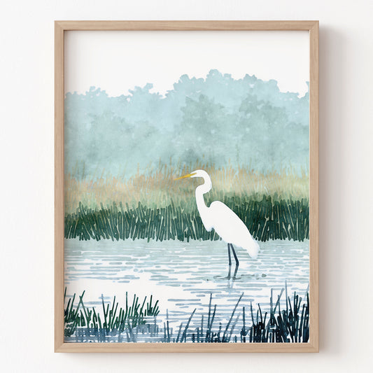 Framed artwork of a white egret in a marshy landscape with reeds and water.